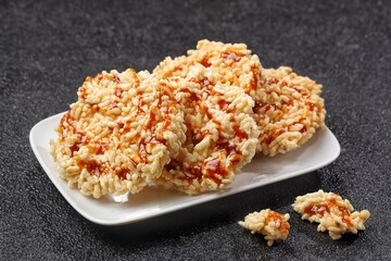 Rengginang Madu. Honey rengginang with Javanese sugar and honey topping is very delicious and crunchy.