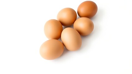 Brown eggs on a white background, showcasing simplicity and natural beauty.