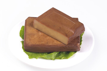 Chinese Dried Tofu Blocks on Lettuce Leaves - Traditional Asian Protein Food Ingredient