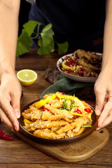 Spicy Chicken Feet Phoenix Style with Lemon Garnish - Fresh Asian Appetizer Cuisine