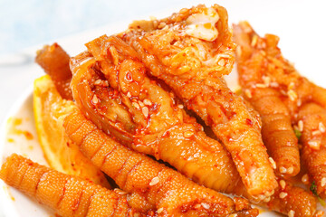 Spicy Glazed Chicken Feet with Hot Sauce and Lemon - Traditional Asian Delicacy Food