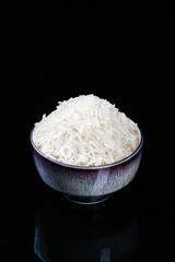 Bowl of White Aromatic Long-Grain Rice on Black Background