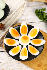 Fresh Hard-Boiled Eggs with Golden Yolks on Rustic Wooden Table - Healthy Natural Food Photography
