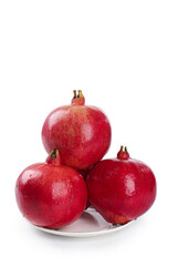 Fresh Red Pomegranates on White Plate - Healthy Superfruit Still Life