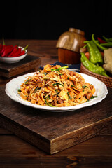 Homemade Fried Vermicelli Noodles with Fresh Vegetables on Rustic Wooden Table