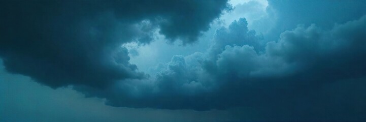 Dark, brooding clouds fill the sky, heavy with impending rain A dramatic, stormy atmosphere perfect for moody or suspenseful projects The wind is visible in the clouds themselves , black, nature