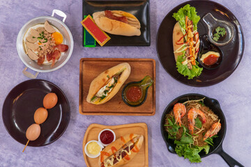 Famous Vietnamese food is banh mi thit, popular street food from bread stuffed with raw material: pork, ham, pate, egg and fresh herbs as scallions, coriander, carrot, cucumber, chilli.