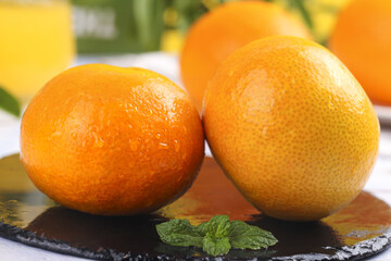 Fresh Picked Ehime Oranges on Slate Board - Premium Japanese Citrus Produce with Mint Garnish