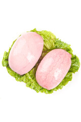 Fresh Raw Pork Loin Slices on Lettuce Leaves - Cooking Ingredients