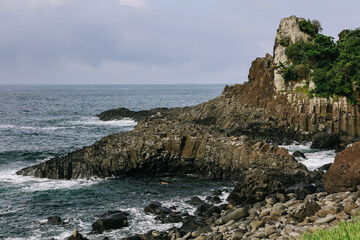 Jusangjeolli Cliff Columnar Joints and sea in Jeju Island, Korea.