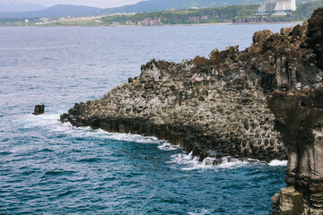 The Daepo Jusangjeolli (Jusangjeollidae) basalt columnar joints and cliffs at Jeju Island, South Korea.