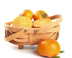 Fresh Shaanxi Persimmons in Wooden Basket on White Background - Ripe Orange Fruit Whole and Sliced
