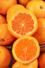 Fresh Seedless Oranges from Guangxi Sihui China Cut in Half Showing Sweet Orange Flesh and Juicy Segments