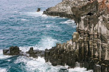 The Daepo Jusangjeolli (Jusangjeollidae) basalt columnar joints and cliffs at Jeju Island, South Korea.