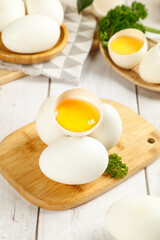 Fresh Free Range Goose Eggs on Wooden Cutting Board with Herbs - Premium Quality Cooking Ingredients