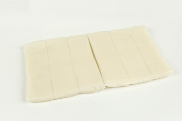 Fresh White Tofu Blocks Cut and Ready for Cooking on White Background