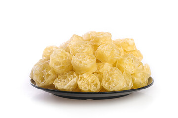 Dried Lotus Root Slices on Black Plate - Traditional Asian Cooking Ingredient with Natural Honeycomb Pattern