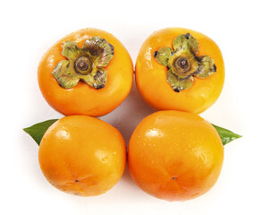 Fresh Fuping Persimmons on White Background - Crisp Orange Fruit with Green Leaves