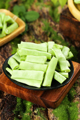 Fresh Green Bean Pods in Bowl on Wooden Cutting Board - Healthy Vegetable Ingredient