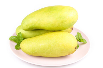 Fresh Golden Mango Fruit with Green Skin and Mint on White Background