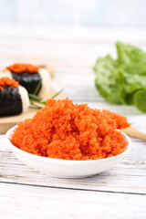 Fresh Orange Fish Roe Caviar in Bowl with Sushi - Japanese Cuisine Ingredient