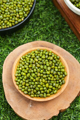 Organic Green Mung Beans in Wooden Bowl on Grass - Healthy Plant Protein Ingredients