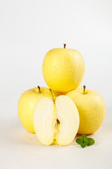 Fresh Golden Yellow Apples with Mint Leaf on White Background - Healthy Organic Fruit