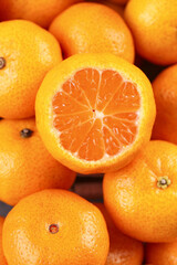 Freshly Picked Seedless Oranges with Half Cut Showing Juicy Segments
