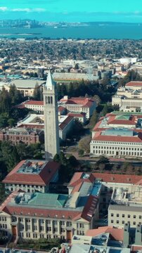 Aerial view of UC Berkeley's iconic Campanile clock tower and campus buildings, showcasing the university's architecture and urban setting in California, USA.