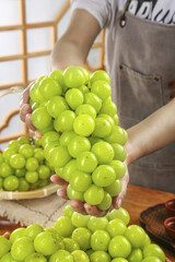 Fresh Green Grapes in Hands Japanese Kitchen Interior Healthy Organic Fruit Harvest