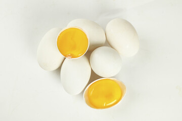 Fresh Free-Range Goose Eggs with Golden Yolks on White Background - Premium Farm Produce