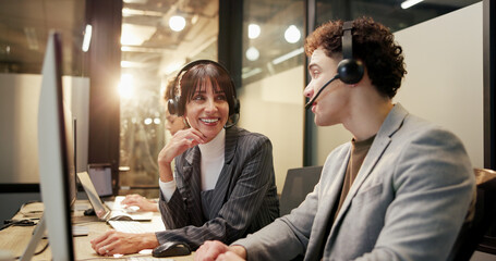 Headset, computer and call center consultant with manager in office at night for feedback on crm....