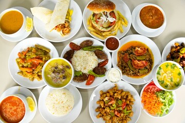 Delicious meat kebab with fresh vegetable salad served with variety of Turkish dishes and appetizers. Top view of assorted Turkish food and meze, tasty and healthy Mediterranean cuisine. Top view.