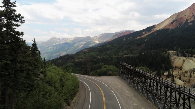 Drone Flight along the trestle at the entrance of the Idarado Mine, part of the Red Mountain Mining District in between Ouray and Silverton Colorado on the Million Dollar Highway HWY 550