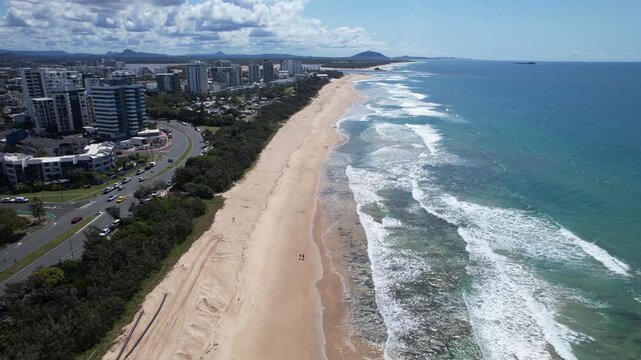 Coastal Road Along Sandy Beach Of Alexandra Headland On The Sunshine Coast Of Queensland, Australia. Aerial Drone Shot