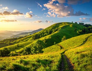 Obraz premium A scenic view of rolling hills at sunset, with lush green meadows and a winding path, bathed in golden light.