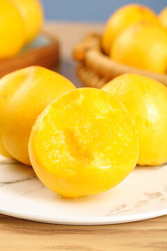 Fresh Yellow Peach Halves on White Plate - Juicy Summer Fruit Ready to Eat