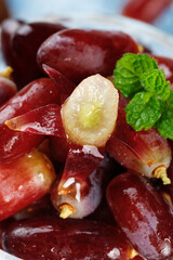 Fresh Red Finger Grapes with Mint Garnish Showing Golden Interior