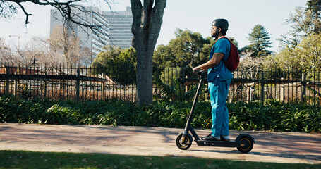 Man, medical student and scooter at campus, travel and outdoor with backpack, helmet and ride to class. Person, electric vehicle and transport to university for education, development or learning © ChasingMagic25/peopleimages.com