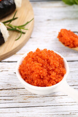 Fresh Orange Fish Roe Caviar in Bowl - Korean Style Culinary Ingredient on Wooden Background