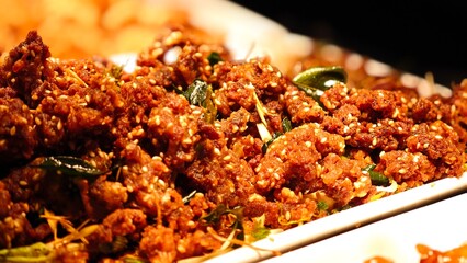Fried crispy beef with herbs, tender inside. Savory dish.