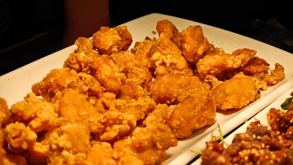 Fried crispy chicken, tender inside. Savory dish.