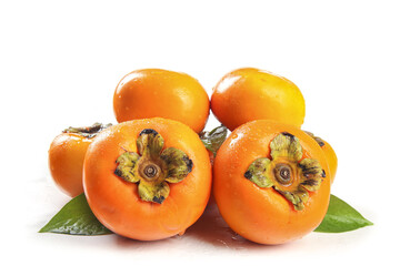 Fresh Fuping Persimmons from Shanxi China on White Background - Ripe Orange Autumn Fruit with Green Leaves