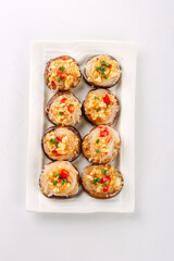 Stuffed Portobello Mushrooms with Garlic and Mixed Vegetables on White Plate
