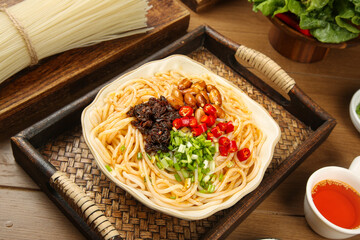 Asian Mixed Noodle Bowl with Rice Noodles and Colorful Toppings on Bamboo Serving Tray