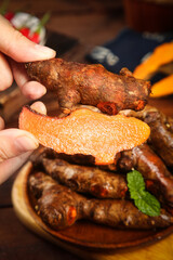 Fresh Turmeric Root with Vibrant Orange Interior - Natural Spice and Seasoning Ingredient