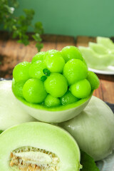 Fresh Honeydew Melon Balls in Natural Bowl with Sliced Fruit Healthy Organic Produce