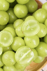 Fresh Green Yunnan Grapes in Wooden Bowl - Seasonal Fruit with Crystal Clear Flesh
