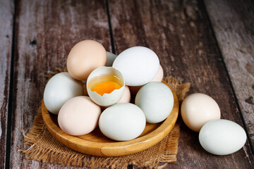 Fresh Organic Free Range Eggs in Wooden Bowl on Rustic Wood Table - Natural Farm Fresh Ingredients