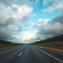 Road under cloudy sky